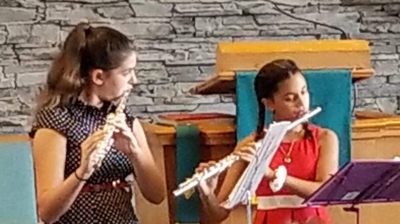 Middle school age Flute-a-rama students play together in concert