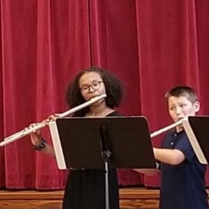 students in grades 5-12 perform together in final concert