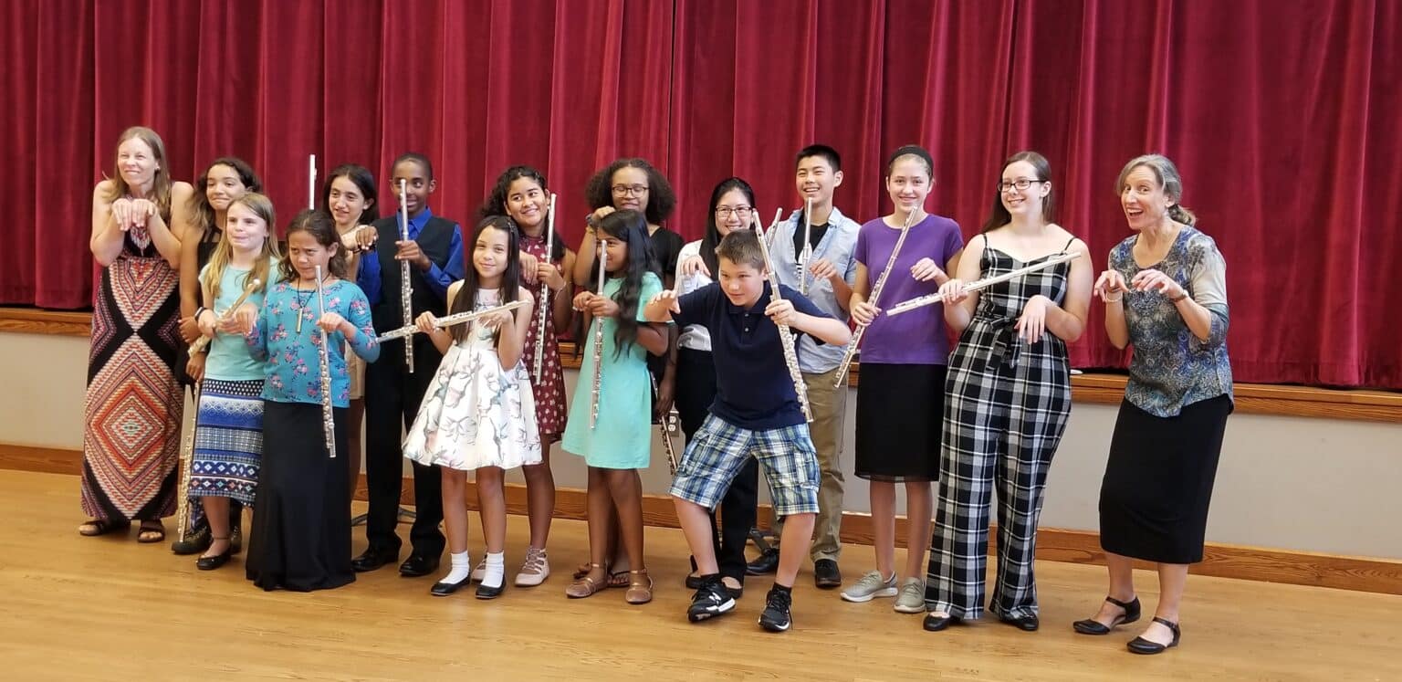 Flute camp students and teachers in goofy pose following final concert